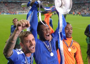 John Obi Mikel (center) with UEFA Champions League cup