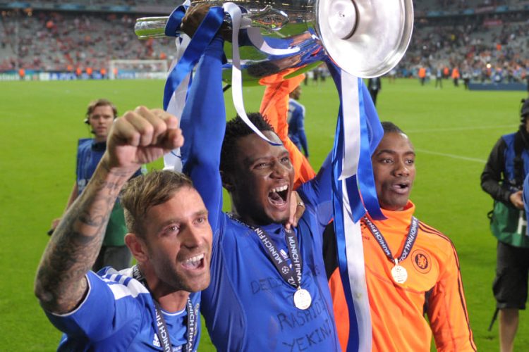 John Obi Mikel (center) with UEFA Champions League cup