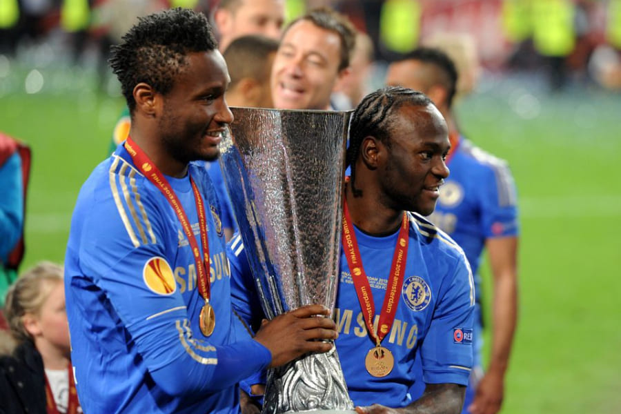 John Obi Mikel (left) and Victor Moses with Europa League title
